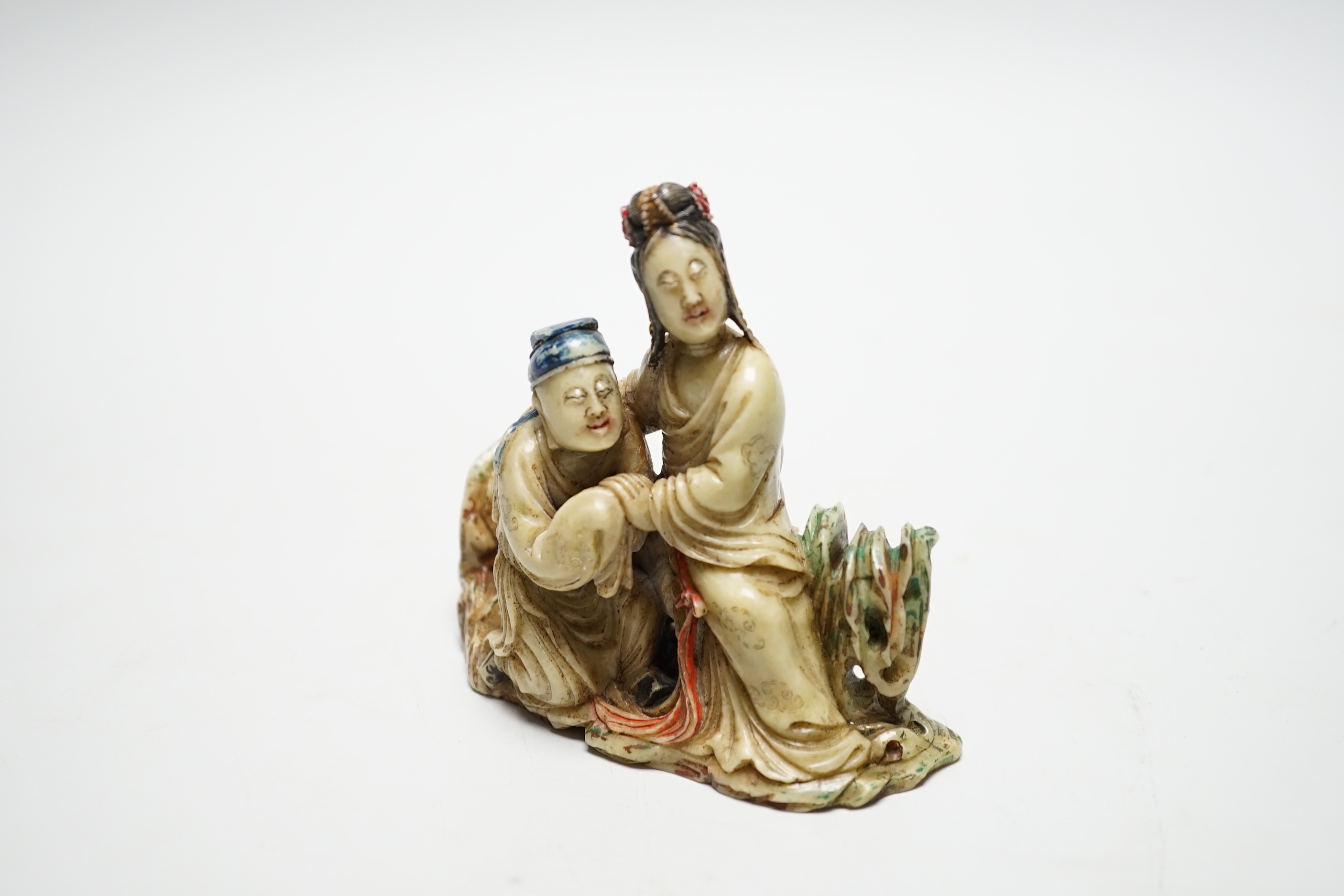 A Chinese soapstone carving - two figures, 19th/20th century, 9.5cm tall